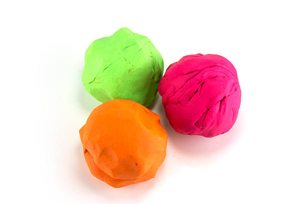 istock three pieces of color plasticine on white background 175034118