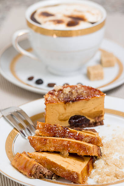 Caramel cake and coffee with cream on background stock photo