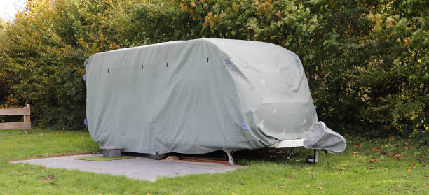 istock a caravan with a gray tarpaulin 1750341445