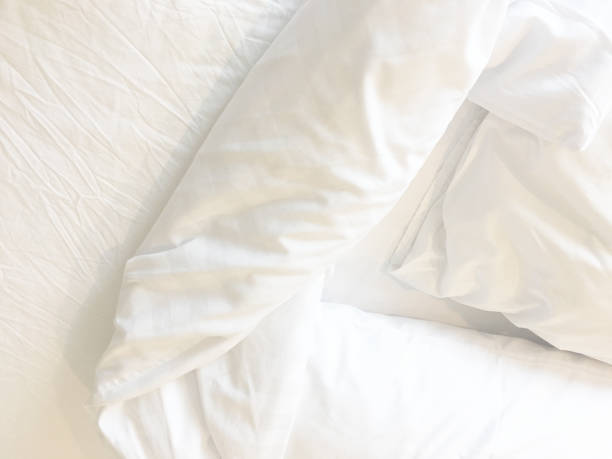 istock White Pillow On Bed And With Wrinkle Messy Blanket In Bedroom, From Sleeping In A Long Night Winter 1750358859