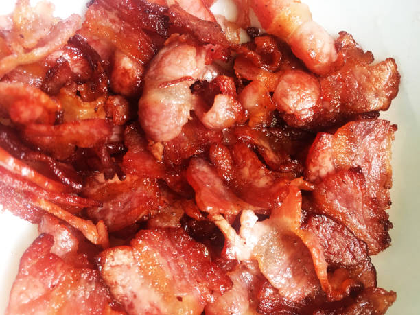 istock Crispy Organic Unhealthy Bacon on a Background 1750381012