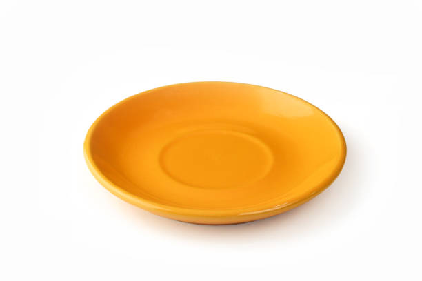 istock One orange ceramic tea cup tray isolated on white background 1750390448