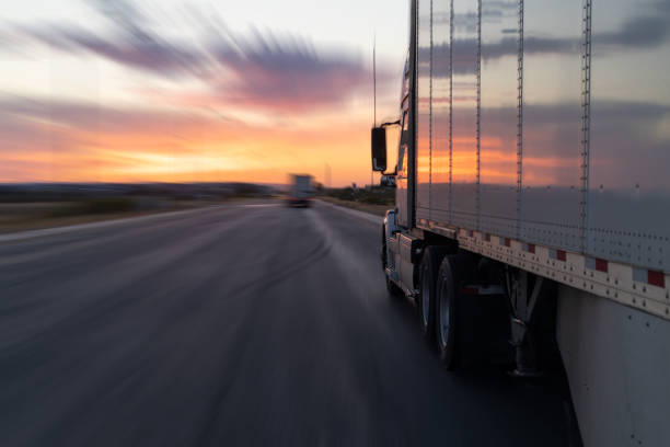 istock trucks and traffic at sunset. highway road 1750395001