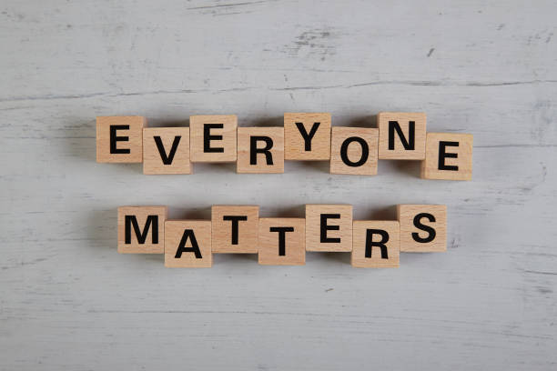 istock wooden blocks  in a white and grey board with the text everyone matters 1750397046