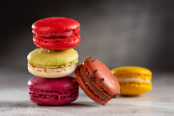 istock Delicious macaroons on the table. Macarons cakes in different colors. 1750407898
