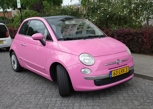 Amersfoort, Netherlands - Aug 13 2023 The car for Barbie: a pink Fiat 500.