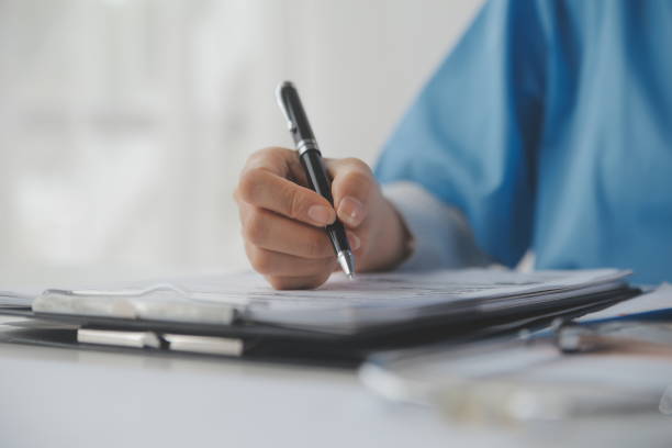 istock Doctor writing out RX prescription selective focus 1750412770
