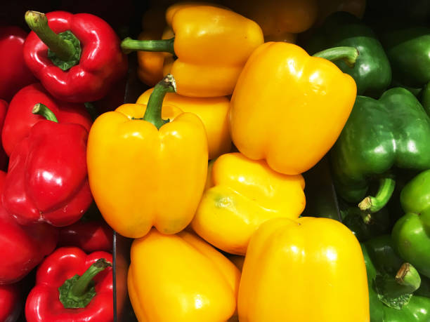 istock Red Yellow and Green Bell Peppers Vegetable Stall Display 1750420761