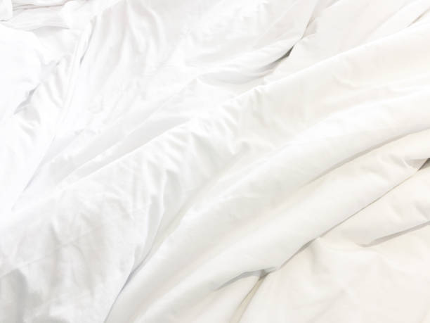 istock Close up of white bedding sheets and copy space 1750424232