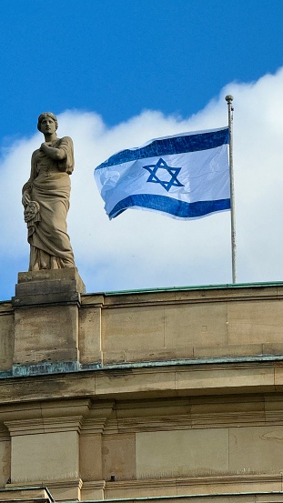 Stuttgart, Germany - October 22nd - 2023: Opera house, roof view with a waving Israel flag.