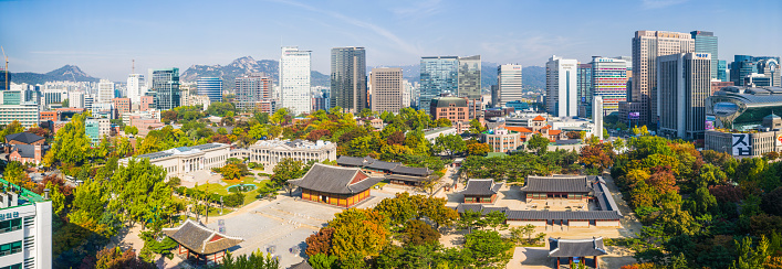 The modern skyscrapers of central Seoul overlooking the tranquil pavilions of Deoksugung in the heart of South Korea’s vibrant capital city.