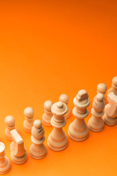 istock Wooden chess figurines on blue background. 1750452461