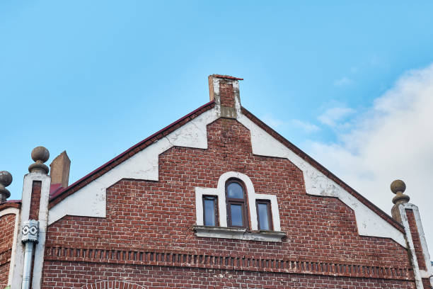 istock Facade of an old brick building with small windows. 1750454169