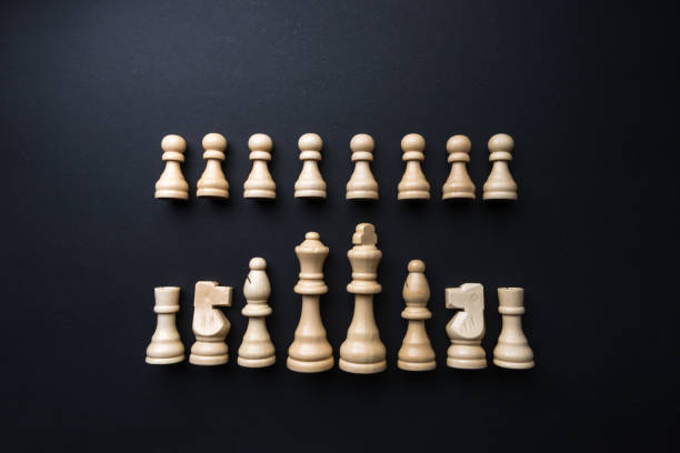 istock Wooden chess figurines on blue background. 1750454692