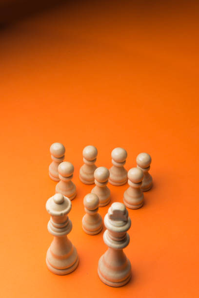 istock Wooden chess figurines on blue background. 1750455279