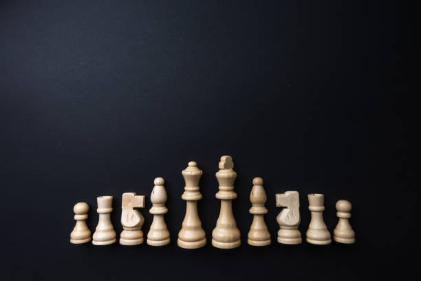 istock Wooden chess figurines on blue background. 1750461885