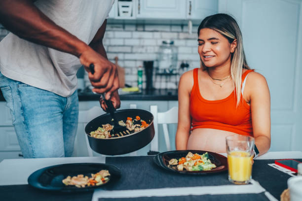 istock Man cooking for his pregnant wife 1750483086