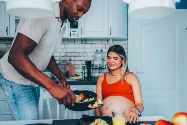 istock Man cooking for his pregnant wife 1750484741