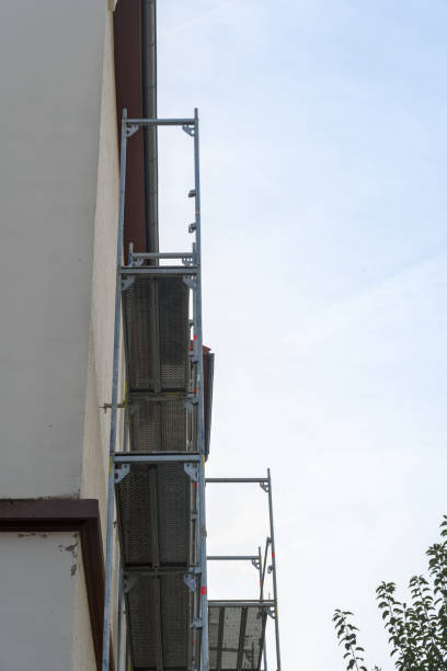 istock A white house with a scaffold outside, building site 1750494918