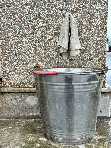 istock aluminum bucket on an ancient wall 1750498221