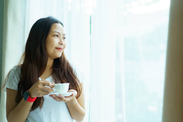 istock Woman enjoy a hot drinks in morning. 1750516994