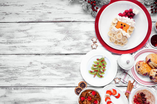 istock Christmas breakfast side border on a white wood background 1750554564