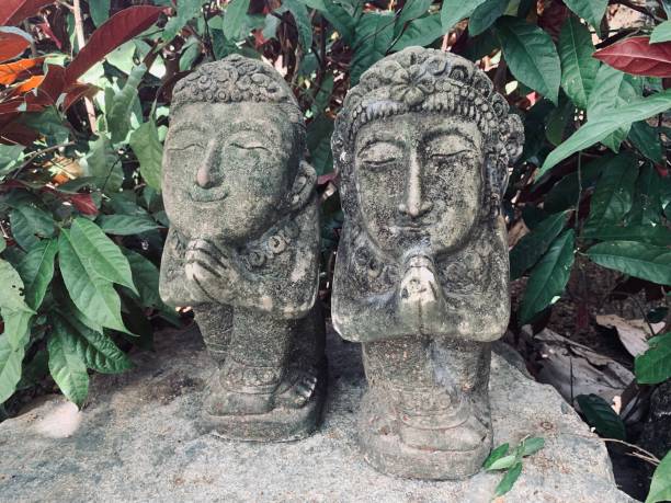 Funny traditional Thai garden sculpture. A couple.