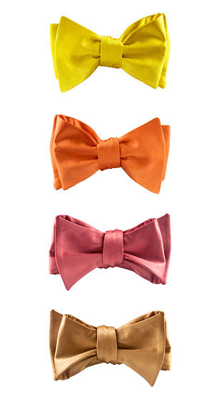 Four silk bow ties isolated on white background. Men's accessories for wedding ceremony