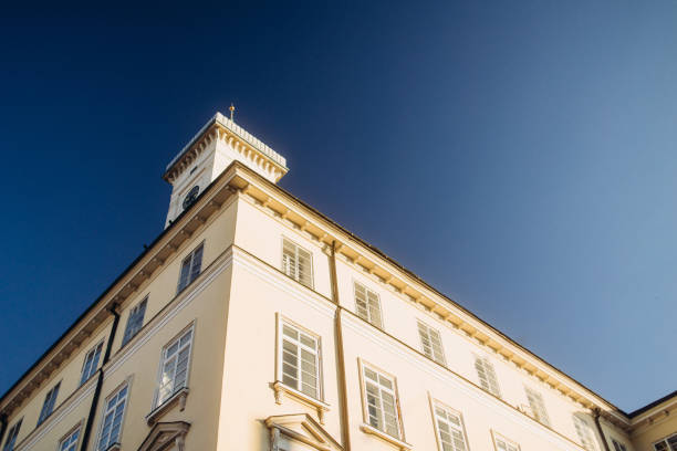 The Lviv city Town Hall against the backdrop of a clear, vibrant blue sky, showcasing the architectural charm of this historic landmark