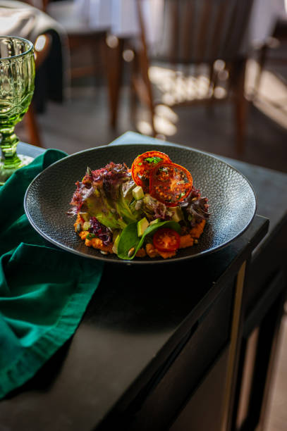 istock Vegetarian salad with avocado, basil, lettuce and cherry tomatoes isolated 1750602625