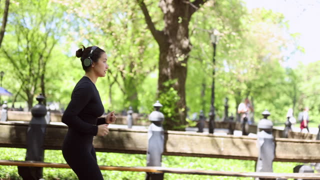 Multiracial girl jogging in Central Park