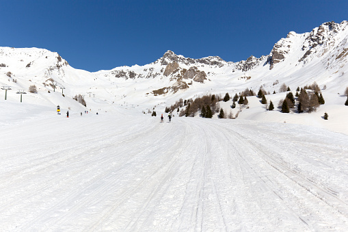 Tonale, Italy - February 21, 2021: view of passo del Tonale during winter with winter tourists