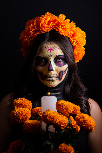 Woman painted as Catrina with flowers