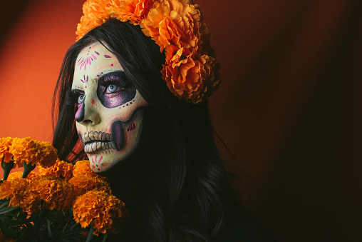 Woman painted as Catrina with flowers