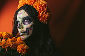 Woman painted as Catrina