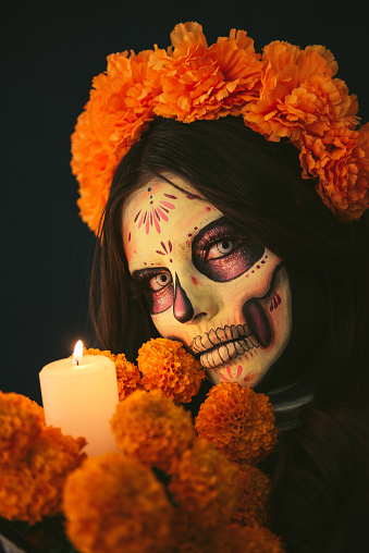 Woman painted as Catrina with flowers