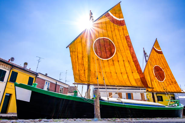 Cesenatico, Italy- April 14, 2013: antique fishing sailing boats at the harbor. The harbor designed by Leonardo da Vinci attracts thousands of tourists every month.