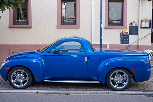 vintage Convertible pickup truck Chevrolet parked on street in city, Retro luxury sports car Super Sport Roadster American company, Oldtimer car, retro-style, Karlsdorf, Germany - October 15, 2023