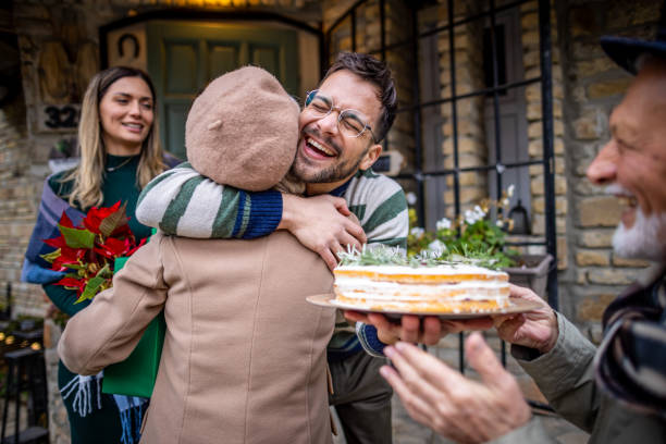 A young man hugging his mother on Christmas