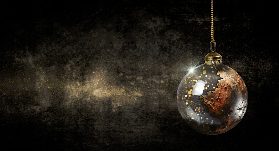 Hanging Christmas Ornament on Grungy Dark Background