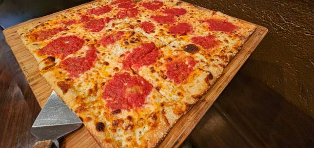 Large Brick Oven Pizza on a Wooden Platter