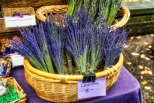 baskets of several bouquets of lavender at the farmer's market
