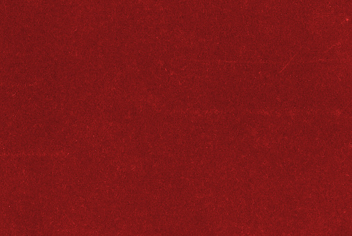 Close up of red construction paper texture full frame.