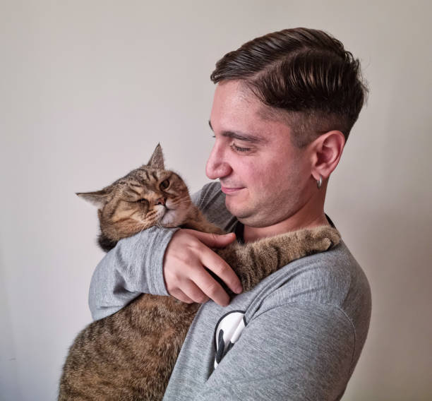 istock Man and cat taking selfie 1750703412