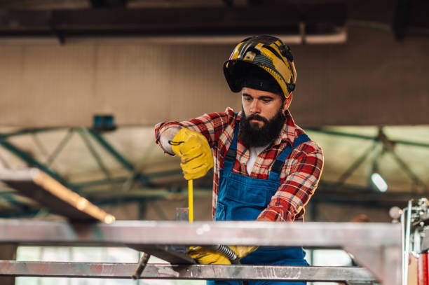 istock Man taking precise measures of the material while wearing safety gear. 1750705639
