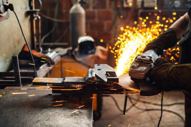 istock Grinding machine in action while hot sparks flying in all directions. 1750708464