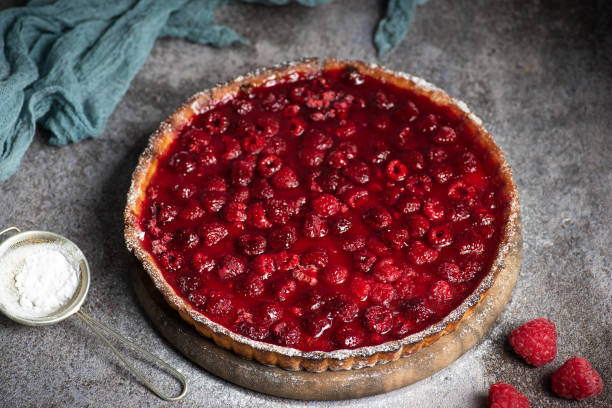 istock Sweet pie with raspberries on grey background 1750730561