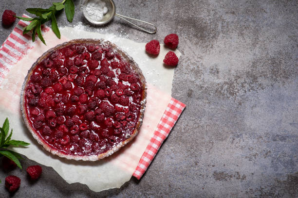 istock Sweet pie with raspberries on grey background 1750731643