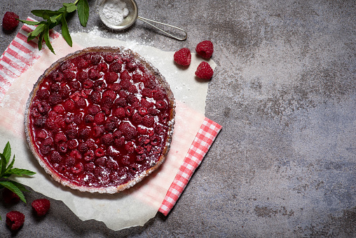 Delicious sweet pie with fresh raspberries. With a crispy crust and a juicy, refreshing filling