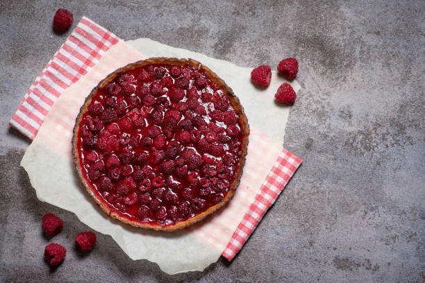 istock Sweet pie with raspberries on grey background 1750732193